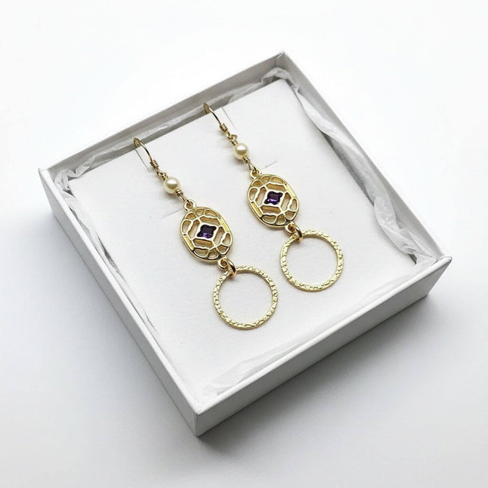 14 K Gold Filled Purple Crystal Circle Filigree Earrings in a gift box, showcasing elegant design and craftsmanship.