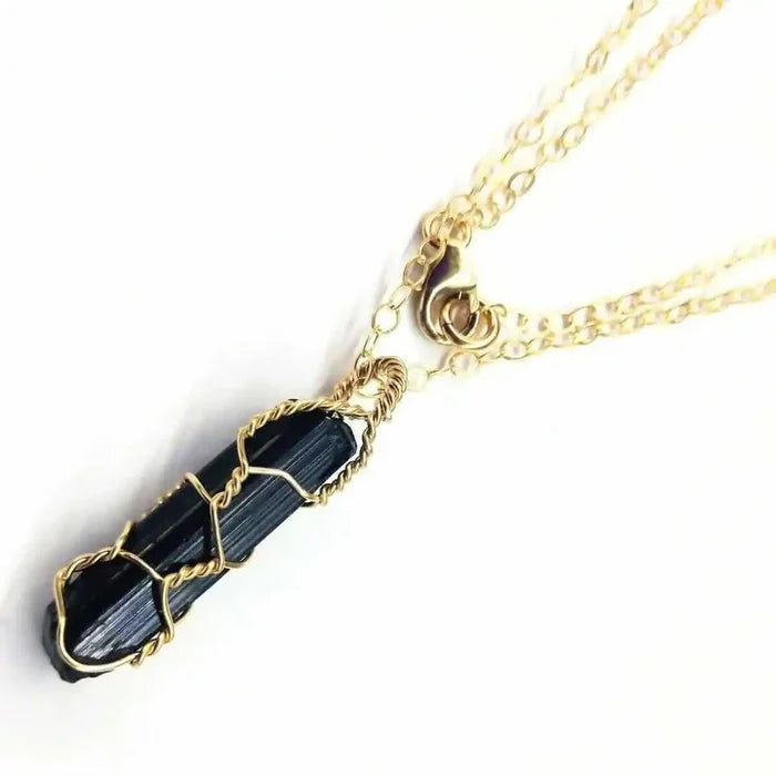14 K Gold Filled Wire Wrapped Raw Black Tourmaline Necklace on gold chain with a polished black tourmaline pendant.