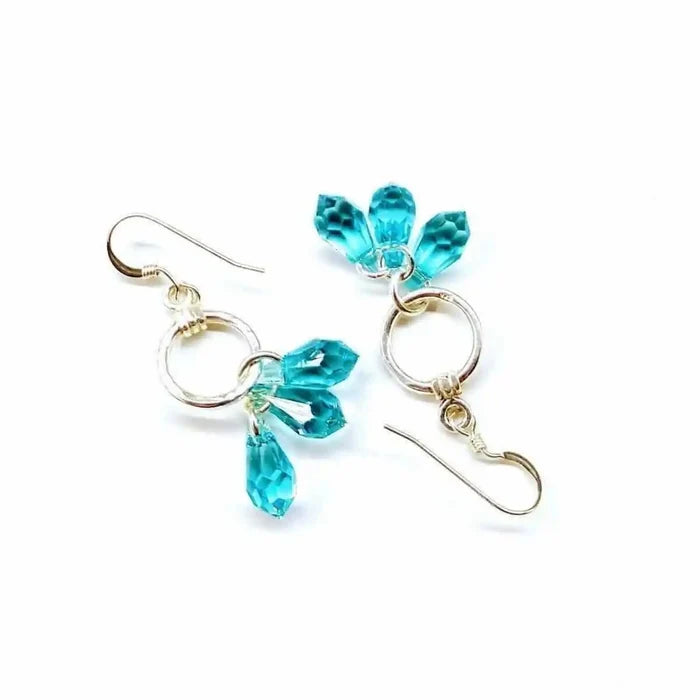 925 Silver Hammered Aqua Crystal Cascading Drop Earrings featuring aqua Swarovski crystals and a hand-hammered silver design.