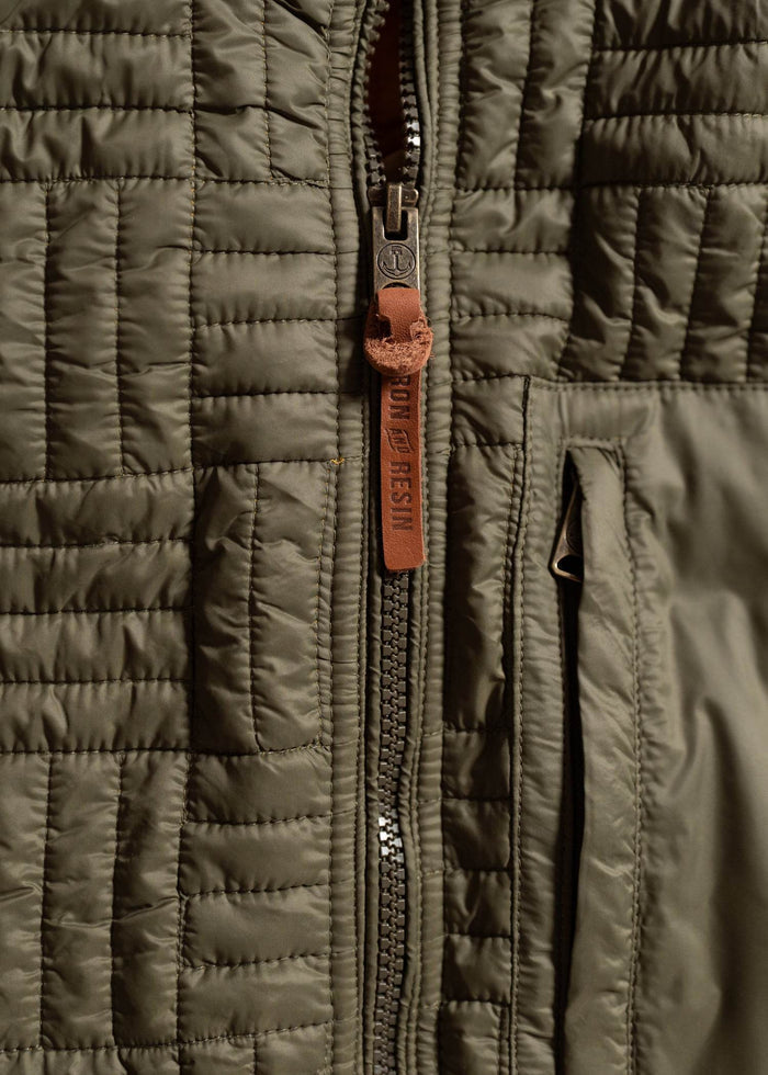 Close up of heavy duty zipper on jacket, highlighting front closure and rugged construction