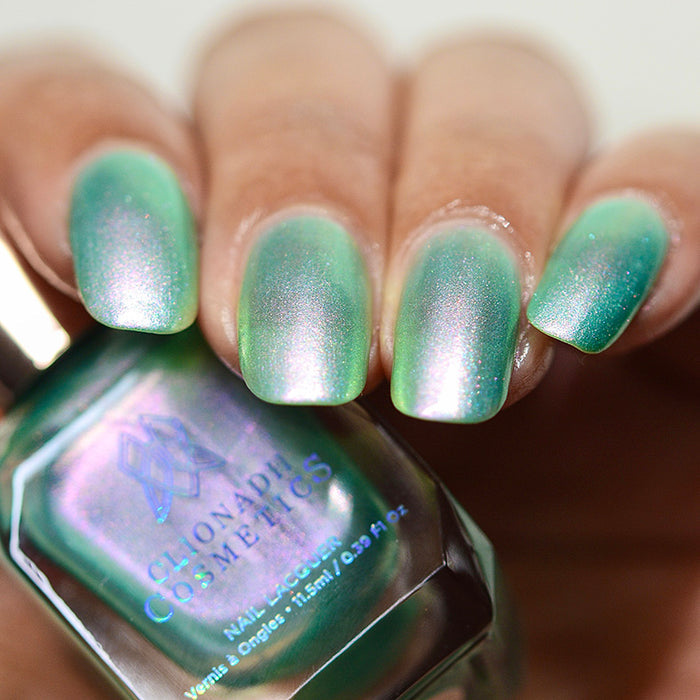 Close up of nails done with Lineage nail lacquer on medium skin tone.