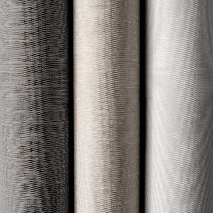 Close-up of three different gray fabric swatches with varying textures.