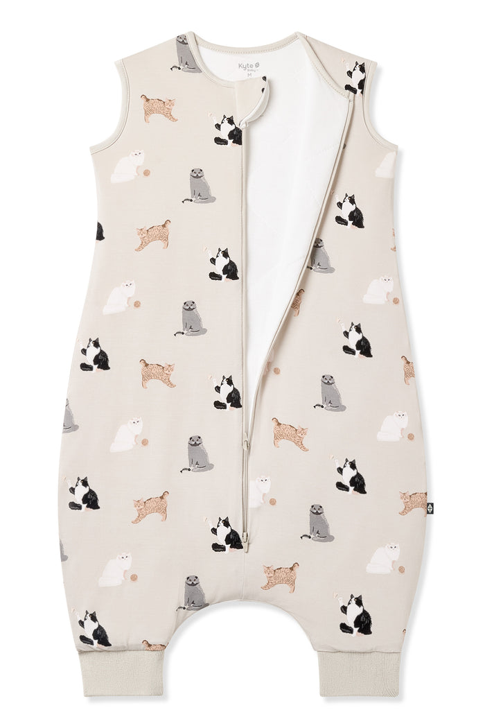 An unzipped Sleep Bag Walker in Fluffy Cat 1.0 on a white surface