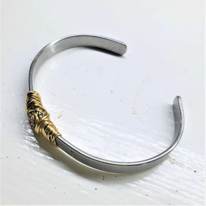 Stainless Steel LOVE Stamped Wire Wrapped Gold Druzy Cuff showcasing elegant wire wrapping design.