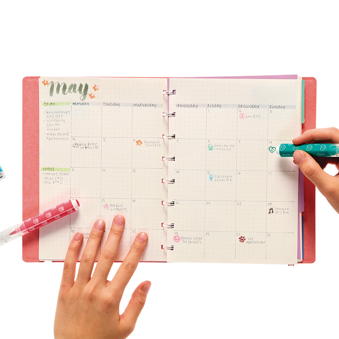 Placing colored stamps in a planner calendar with Stampables Double-Ended Stamp & Brush Markers