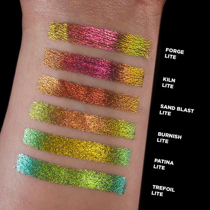Wrist swatches of Forge Lite, Kiln Lite, Sand Blast Lite, Burnish lite, Patina Lite and Trefoil Lite on fair skin tone.