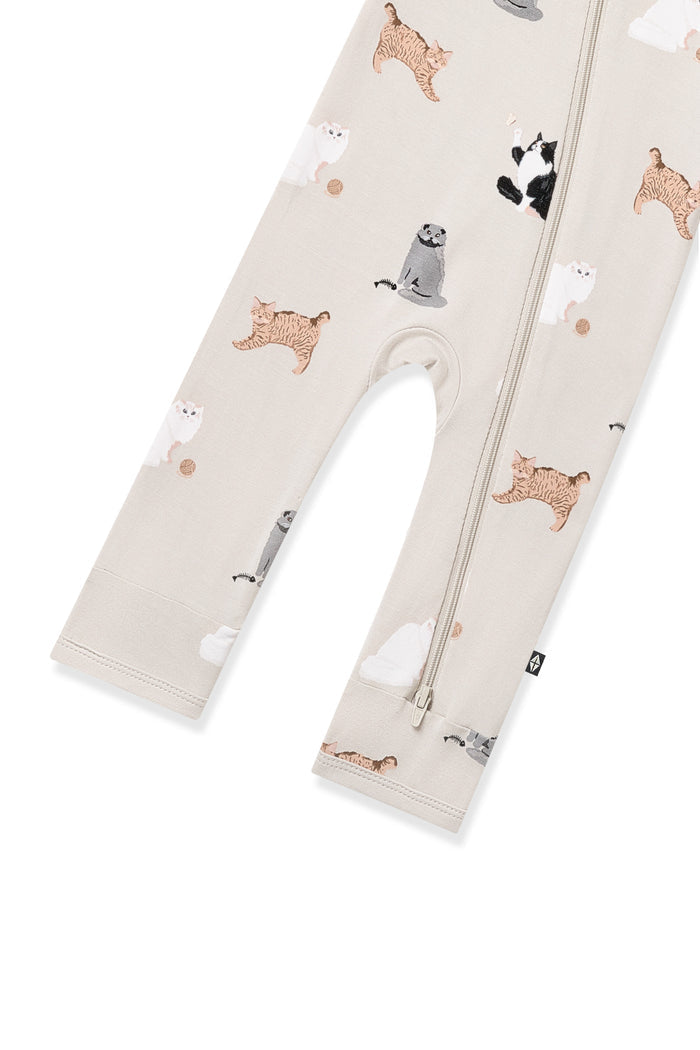 Zipper closure on the leg of the Zippered Romper in Fluffy Cat