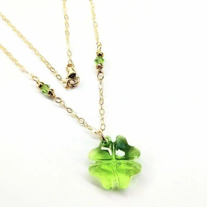 14 K Gold Filled Light Green Crystal Clover Necklace featuring a Peridot-colored Swarovski Crystal and gold chain.