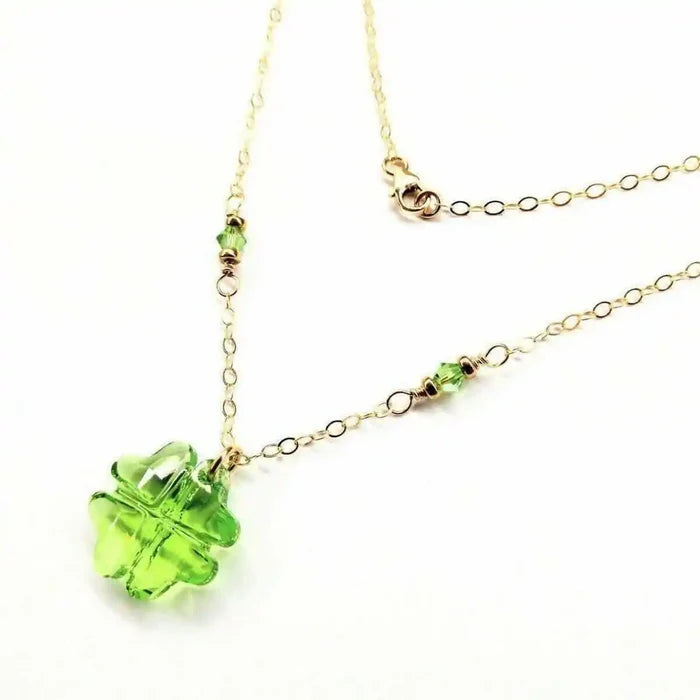 14 K Gold Filled Light Green Crystal Clover Necklace featuring a Peridot-colored Swarovski Crystal and delicate gold chain.