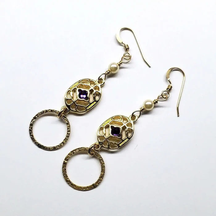 14 K Gold Filled Purple Crystal Circle Filigree Earrings featuring intricate filigree and sparkling purple crystals.