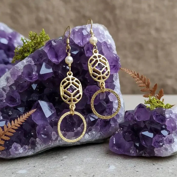 14 K Gold Filled Purple Crystal Circle Filigree Earrings on purple amethyst crystal background