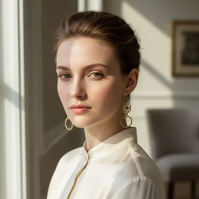 14 K Gold Filled Purple Crystal Circle Filigree Earrings worn by a model in elegant attire.
