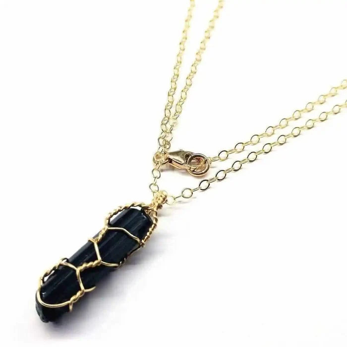 14 K Gold Filled Wire Wrapped Raw Black Tourmaline Necklace showcasing a black tourmaline pendant on a gold chain.