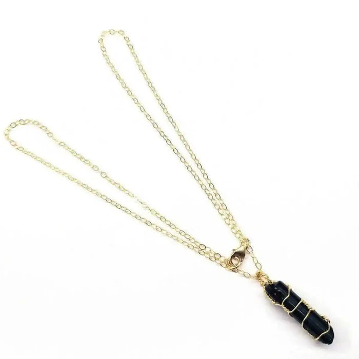 14 K Gold Filled Wire Wrapped Raw Black Tourmaline Necklace with a delicate gold chain.