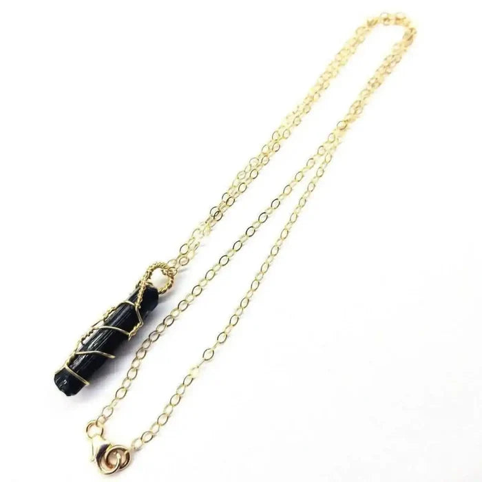 14 K Gold Filled Wire Wrapped Raw Black Tourmaline Necklace with gold chain, showcasing black tourmaline stone.