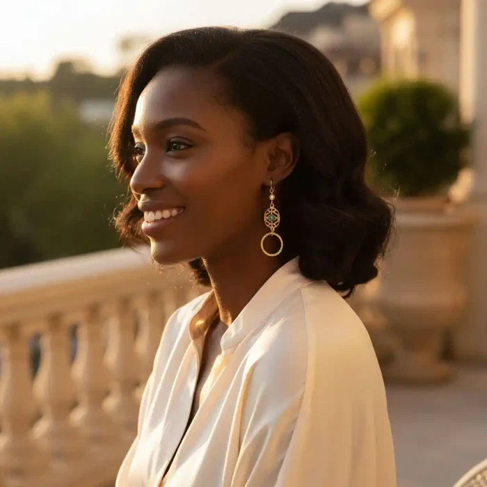 Model wearing 14 KT Gold Filled Green Crystal Circle Filigree Earrings in elegant sunlight.