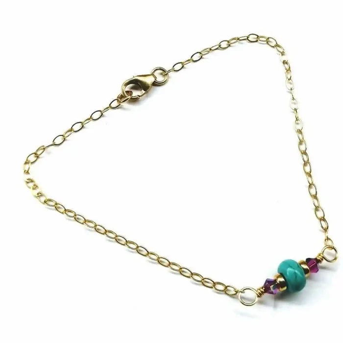 14K Gold Filled Pink and Turquoise Gemstone Dainty Bracelet featuring turquoise and pink gemstones on a gold chain.