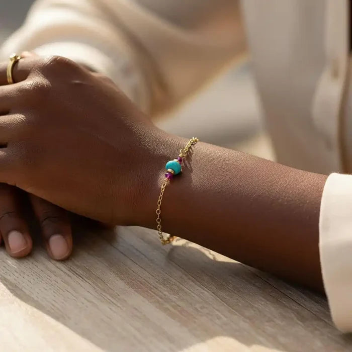 14K Gold Filled Pink and Turquoise Gemstone Dainty Bracelet worn on a hand with a gold chain and colorful beads.