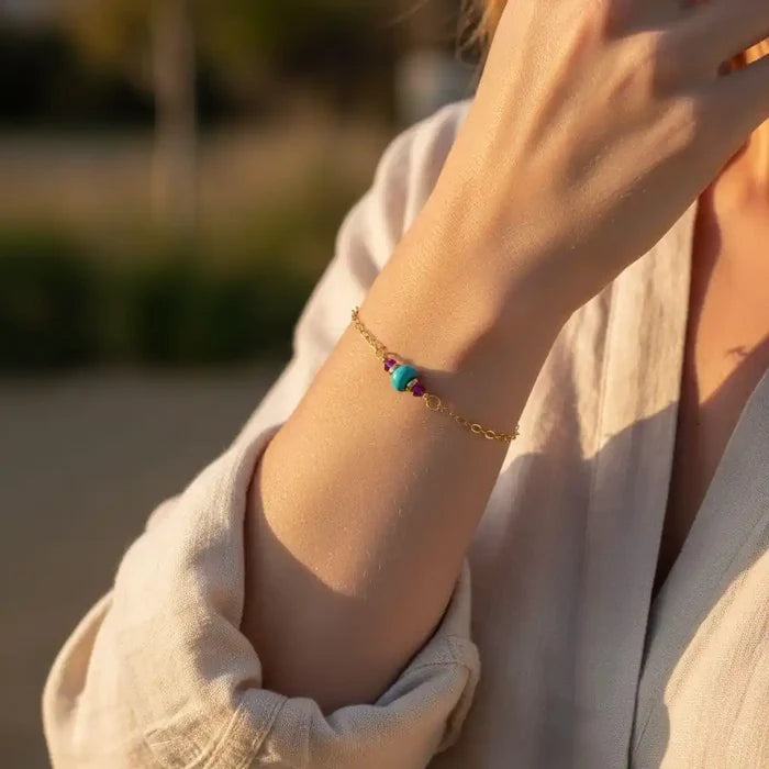 14K Gold Filled Pink and Turquoise Gemstone Dainty Bracelet worn on a woman's wrist, showcasing vibrant gemstones against gold.