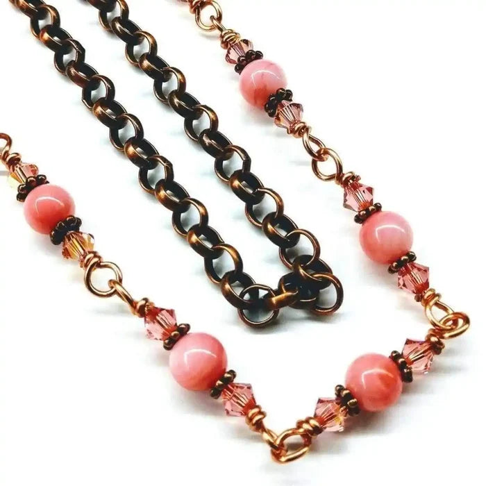24-Inch Copper Peach Pearl Crystal Wire Wrapped Necklace featuring peach pearls and Swarovski crystals on antiqued copper.