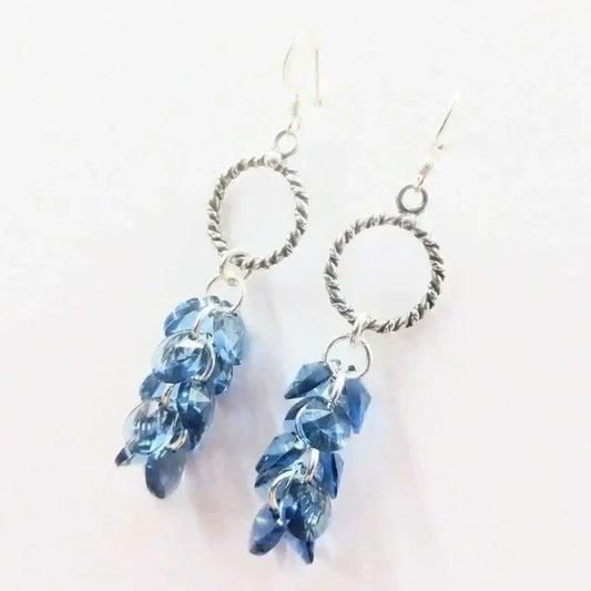 925 Silver Denim Blue Cascading Crystal Cluster Earrings showcasing a dramatic cluster of blue crystals and silver hardware.
