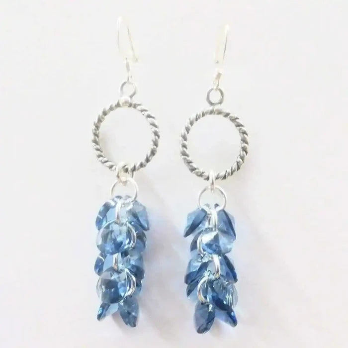 925 Silver Denim Blue Cascading Crystal Cluster Earrings featuring a stunning cluster of blue crystals and silver details.