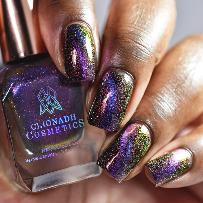 Close up of nails done on deep skin tone with Acid Rain nail lacquer