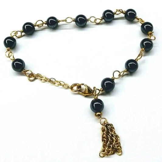 Adjustable 14 KT Gold Filled Hematite Chain Tassel Bracelet featuring hematite beads and gold chain.