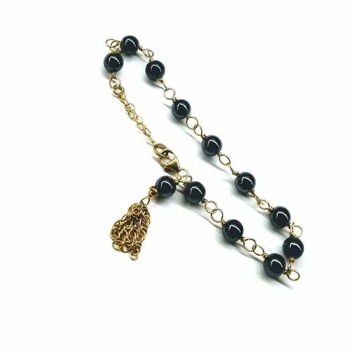 Adjustable 14 KT Gold Filled Hematite Chain Tassel Bracelet featuring gold chain and hematite beads.