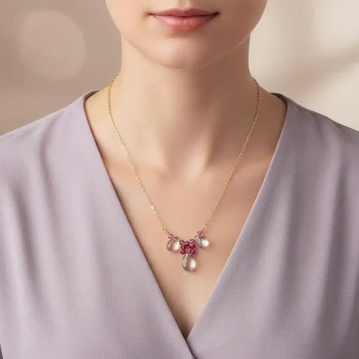 Adjustable Gold Filled Wire Wrapped Gemstone Necklace showcased on a model, featuring pink and clear gemstone drops.