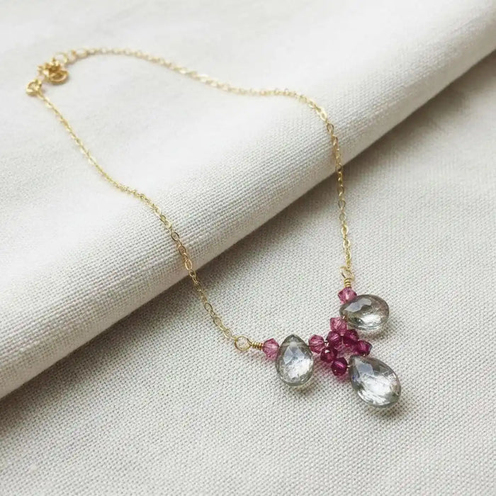 Adjustable Gold Filled Wire Wrapped Gemstone Necklace featuring mystic rainbow quartz and fuchsia Swarovski crystals.
