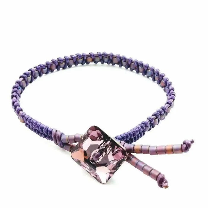 Amethyst Braided Leather Swarovski Crystal Button Bracelet featuring a unique braided design and sparkling crystal.