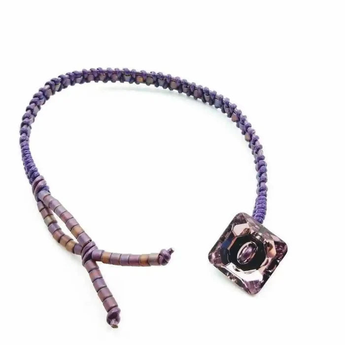 Amethyst Braided Leather Swarovski Crystal Button Bracelet showcasing a unique braided design with a stylish purple crystal button.