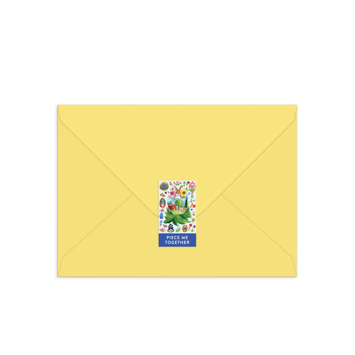 A yellow envelope sealed with a vibrant floral sticker, with “PIECE ME TOGETHER” below—just like sending Jennifer O Lewis / August Wren’s Artisanal Eggs Greeting Card Puzzle, perfect for sharing heartfelt Easter wishes and surprises.