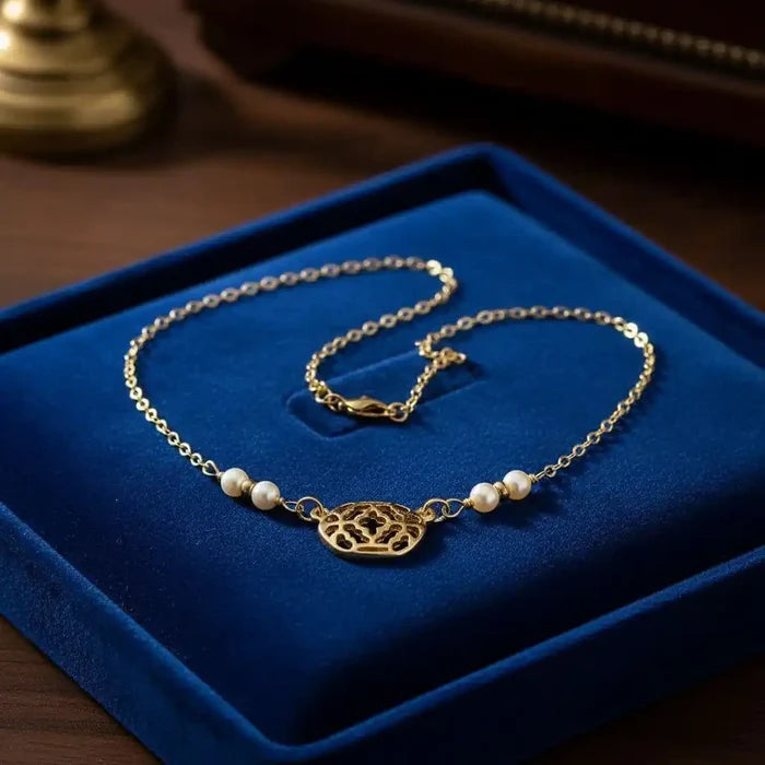 As Seen on Molly Ringwald Gold Filled Pearl Choker Necklace displayed on a blue velvet background.