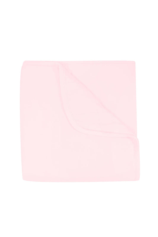 Solid light pink color blanket on a white background