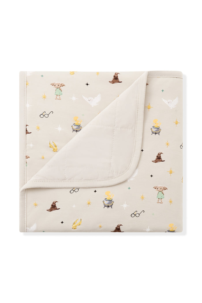 Beige Baby blanket with Harry Potter patterns on a white background