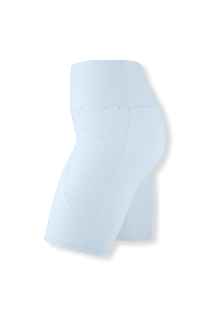Side view of the Bamboo Flex High Rise Biker Short in Breeze on a ghost mannequin showing the side pocket