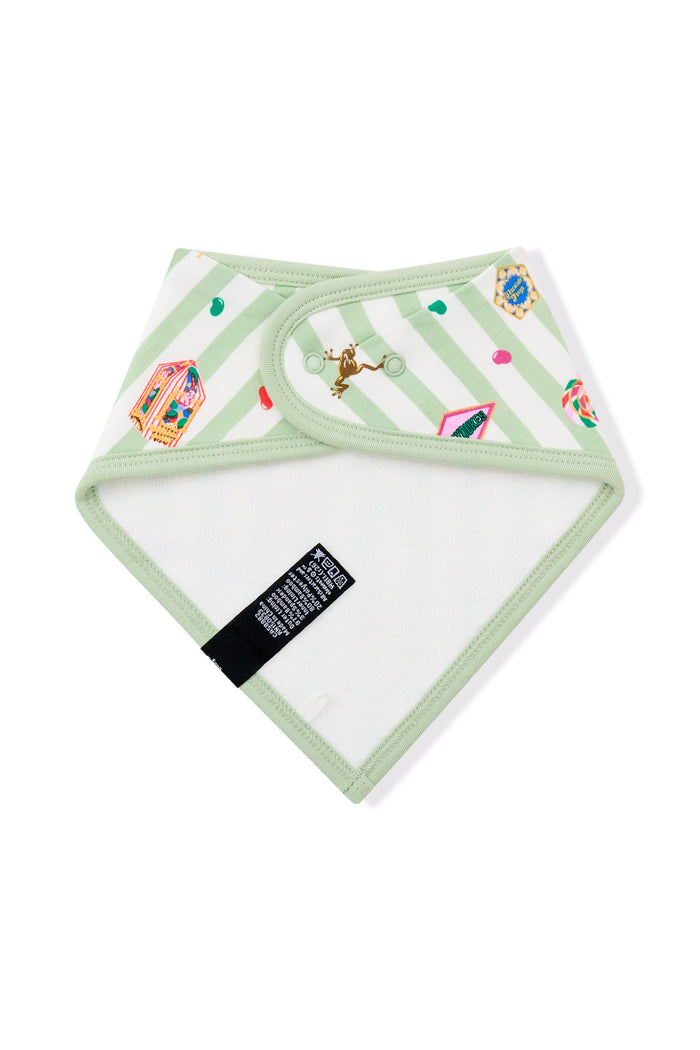 White fabric on Back side of green and white striped bib with colorful Harry Potter patterns on a white background