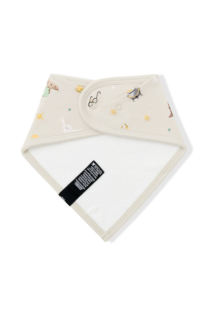 White fabric on the Back side of Beige bib with Harry Potter prints on a white background.