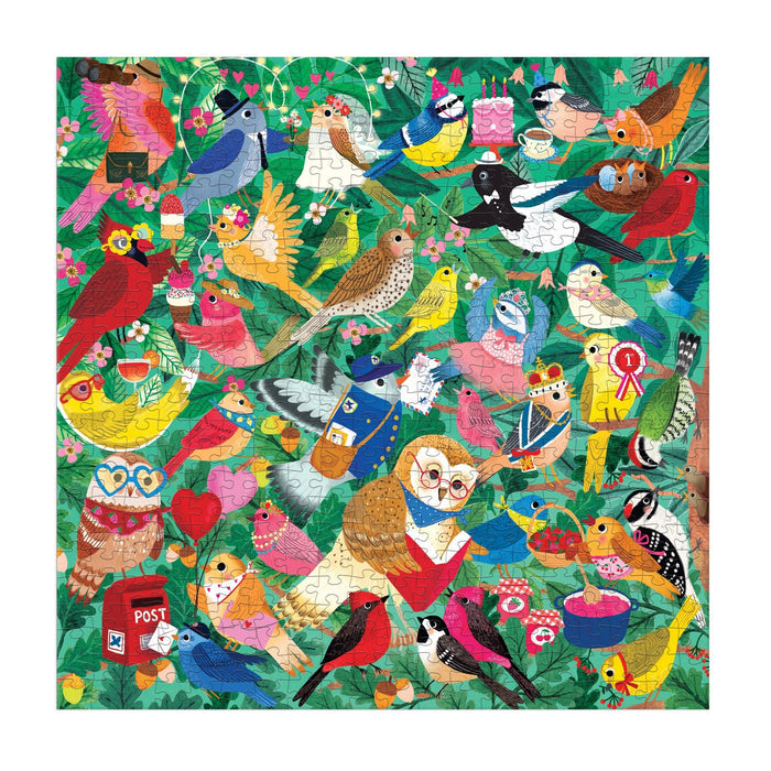 The Birding Around 500 Piece Puzzle by Rebecca Jones features vibrant artwork of owls, cardinals, parrots, leaves, and flowers—a perfect choice for nature lovers.
