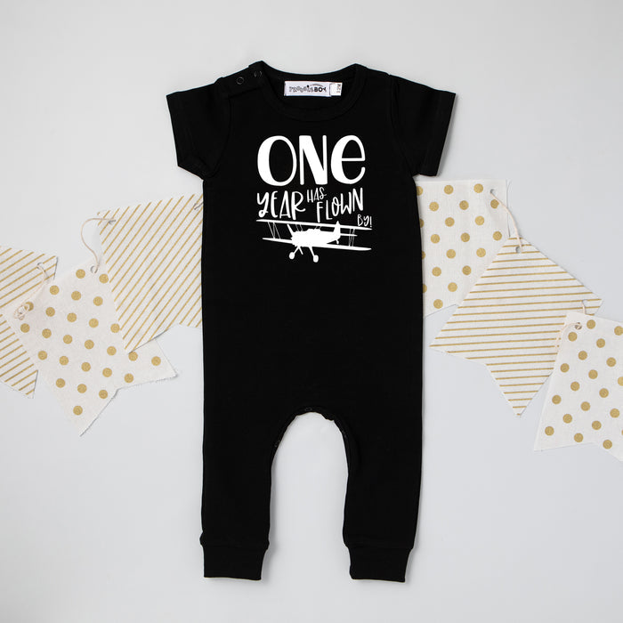 Black "One Year Has Flown By" Airplane Slim Fit 1st Birthday Romper