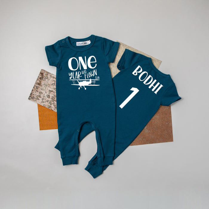 Black "One Year Has Flown By" Airplane Slim Fit 1st Birthday Romper