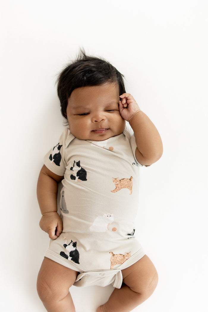 Close up of newborn wearing the Bodysuit in Fluffy Cat
