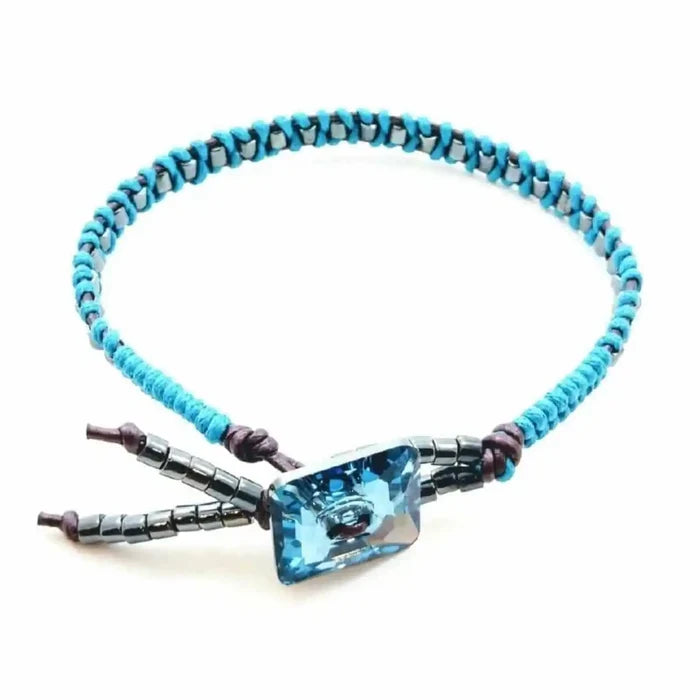 Aqua Hematite Bead Braided Swarovski Crystal Button Bracelet showcasing its intricate design and unique colors.