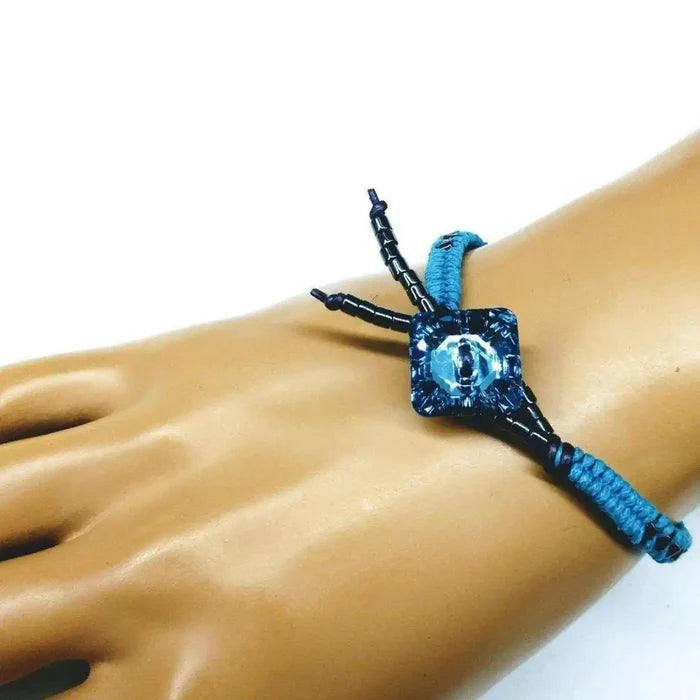Aqua Hematite Bead Braided Swarovski Crystal Button Bracelet on a model's wrist, showcasing its unique design.