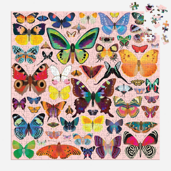 A nearly finished Brilliant Butterflies 500 Piece Puzzle by Natasha Durley shows colorful butterflies on a light pink background, with just a few pieces left to place in the top right corner.