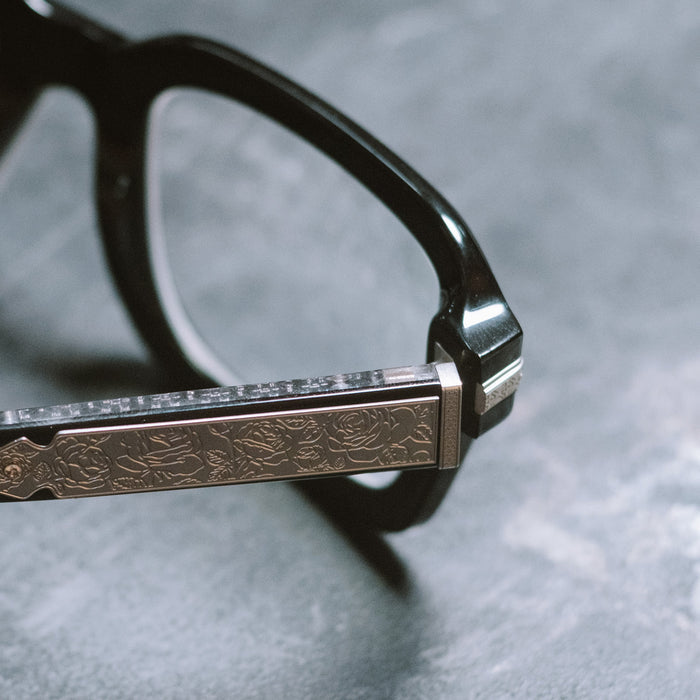 still life - diff eyewear x stephen wilson jr. calico creek square prescription glasses with a black acetate frame detailed temple view