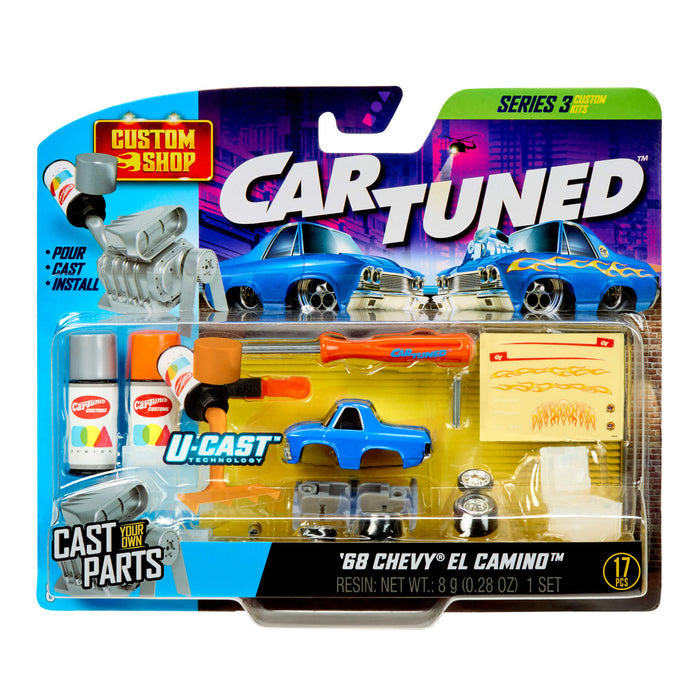 Packaged toy car with accessories and tools on a white background