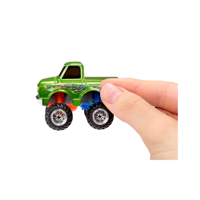 Fingers putting on a flame decal on a white background